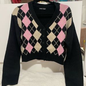 Cropped knit cardigan.